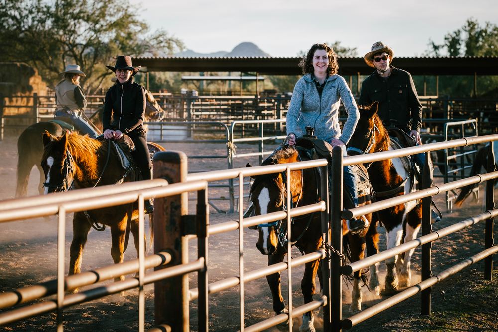 Riders at the corral rail